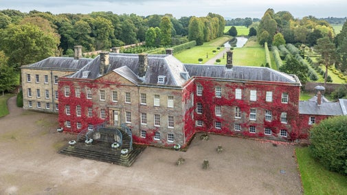 An aerial view of the house and garden at Erddig in autumn.